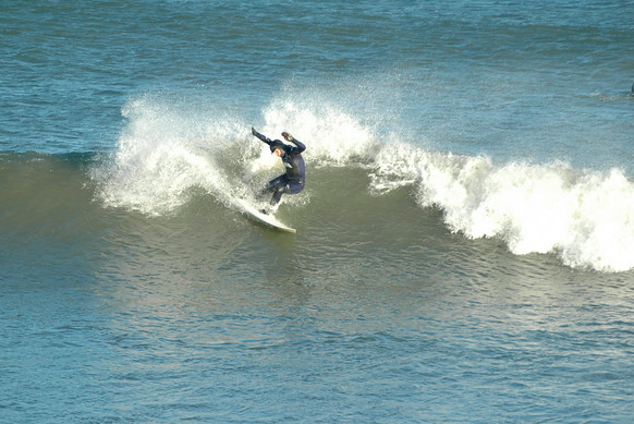 Screen Shot 2014-10-24 at 6.39.33 PM Surf like a girl in the Winter! Ana prefers the tropics but still throws down big slashing turns on cold RI winter waves!